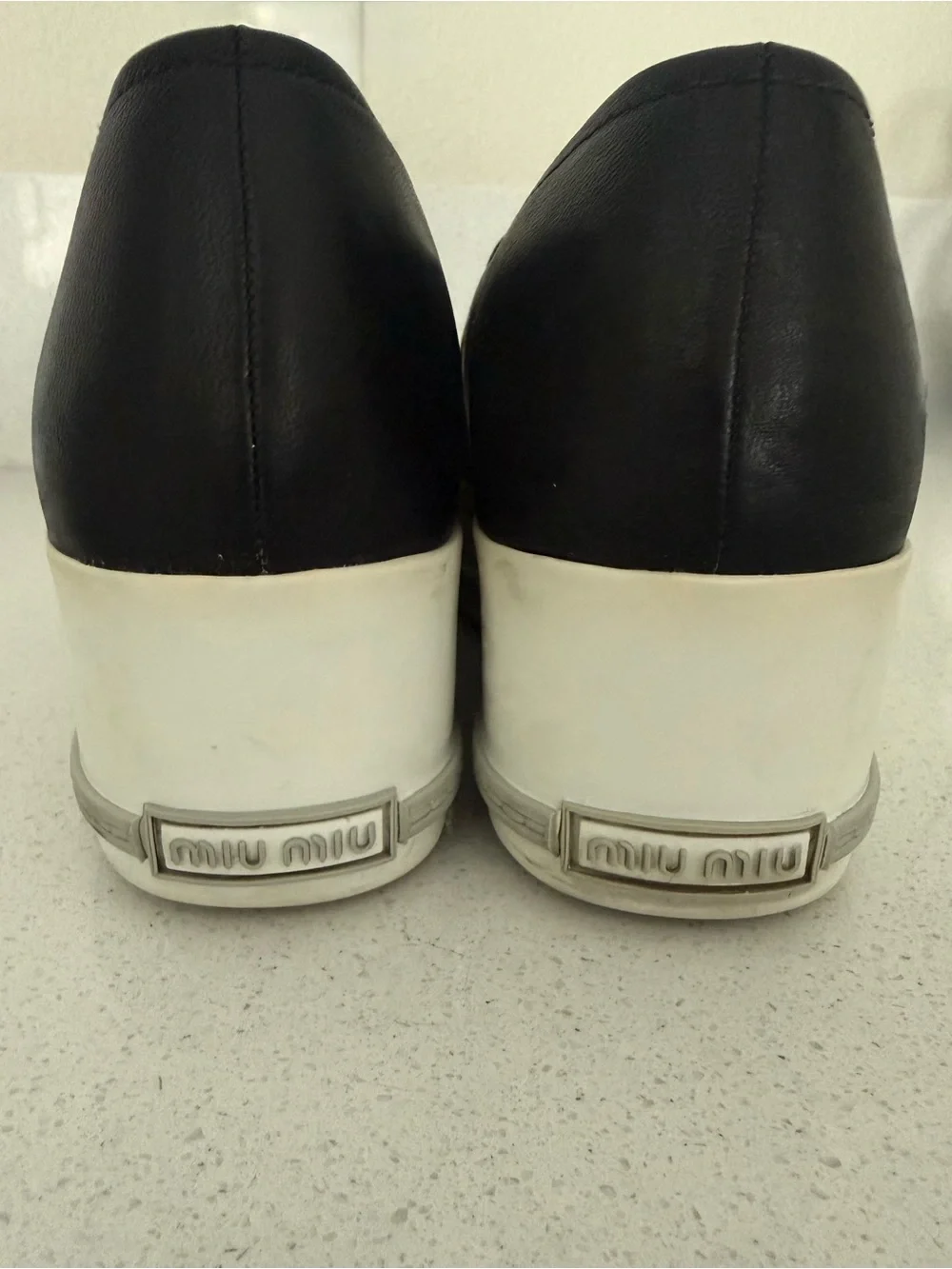 Miu Miu Black Leather Slip-On Sneakers with Silver Cap Toe